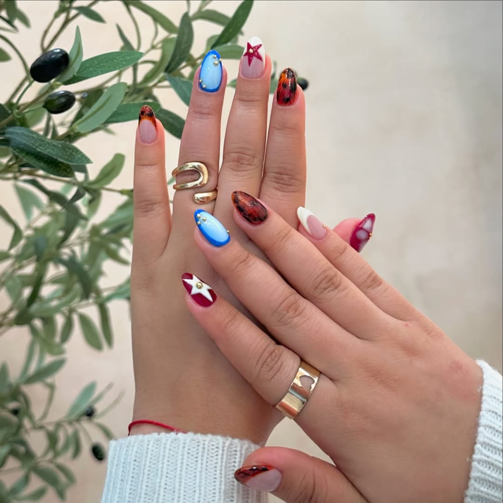 Recent NailMuseMiami nail set with tortoiseshell and star nail art